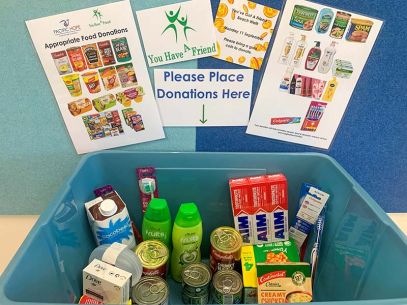 A basket filled with various items for donation.